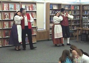 Performing a folk dance at a library