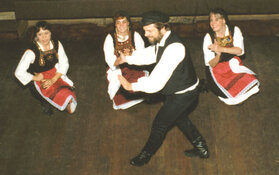 Greek folk dancer performing Zeibekikos at a party